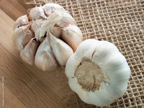 Fresh garlic,  rustic style, wooden background