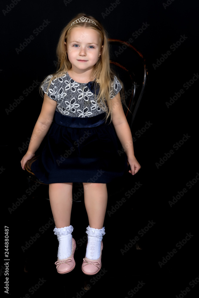 Little girl on a black background Little girl on a black background
