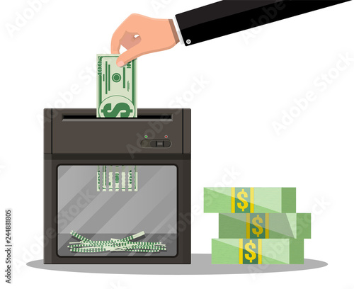 Hand putting dollar banknote in shredder machine