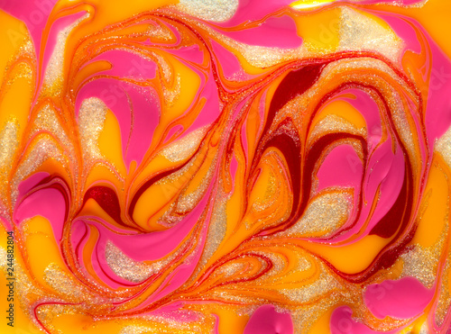 Vibrant red and yellow marbling texture. Abstract colorful background. Liquid marble paint.