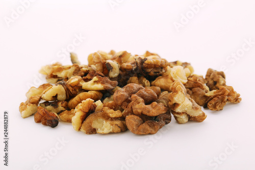 A pile of peeled walnuts at white background