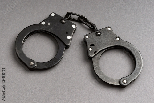 handcuffs on gray background