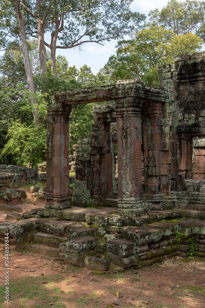 Ruins of Banteay Kdei columns in trees