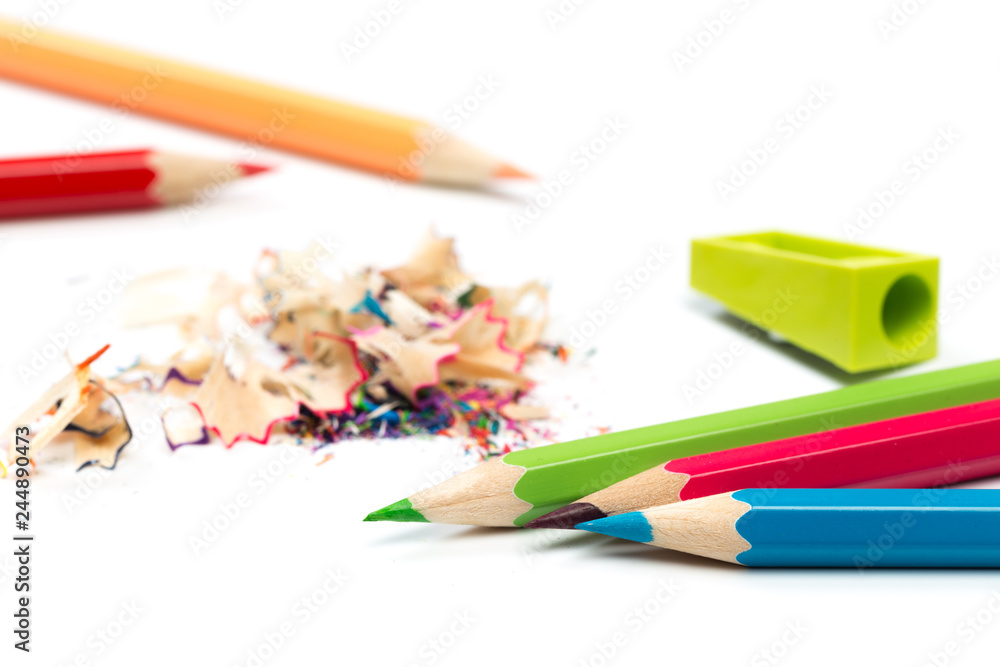 colored pencils and shavings with pencils. Sharpener of pencils on a white background. colored pencils and shavings with pencils. Sharpener of pencils on a white background.