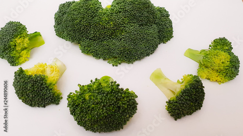 Broccoli. Large and small pieces of broccoli. Healthy food. White background.