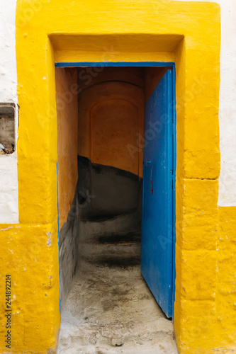 Opened Arabic door in Morocco (Marrakesh) in a traditional Arab houseTraditional oriental style and design in Muslim countries photo