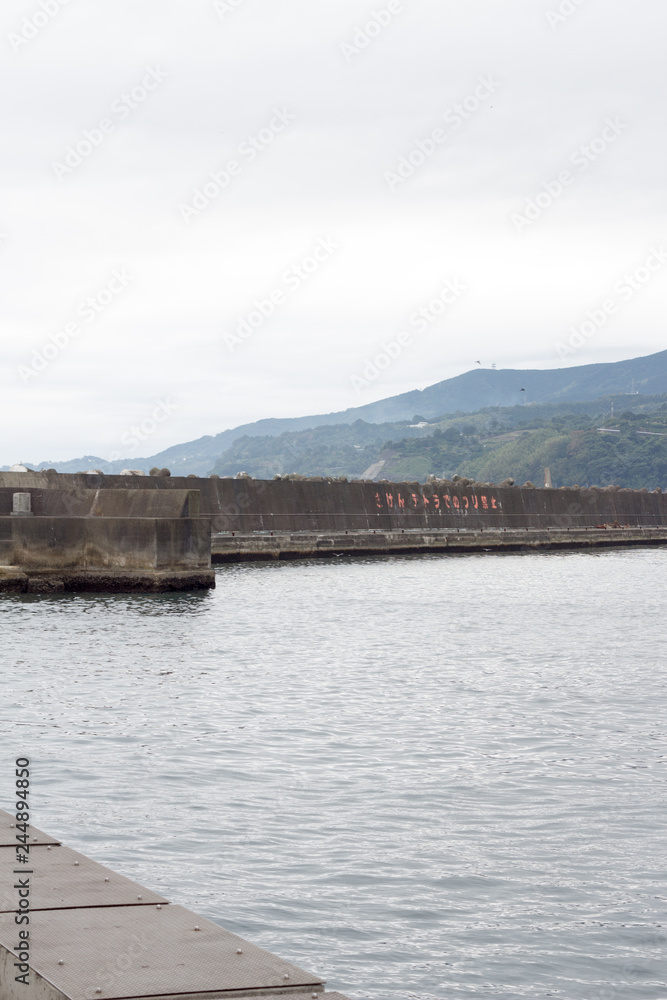 Breakwater on cold cloudy day in Japan Breakwater on cold cloudy day in Japan