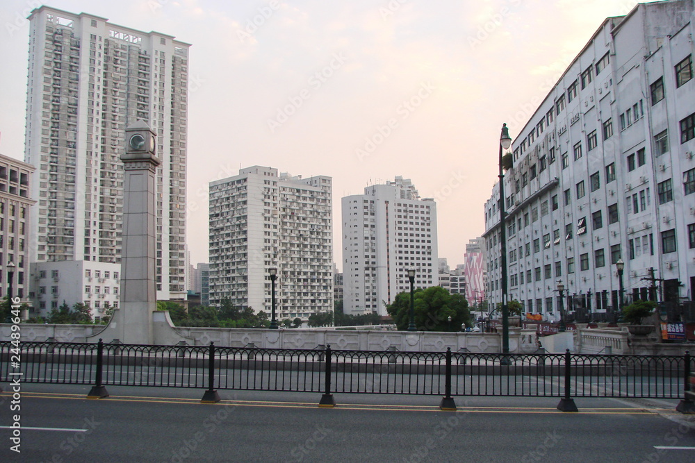 Panorama of streets with high skyscrapers in the modern business districts of the great Chinese city against the background of the spring sky.