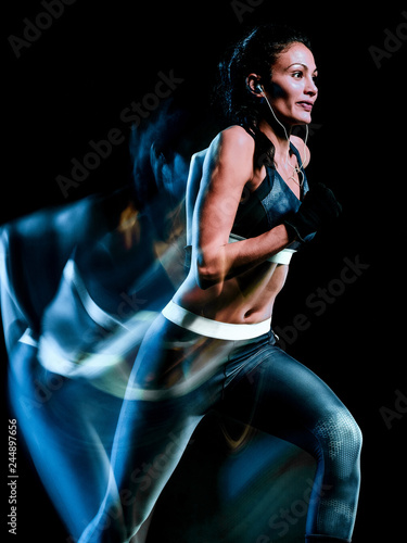 one beautiful caucasian mixed race woman unner jogger jogging running in studio isolated on black background