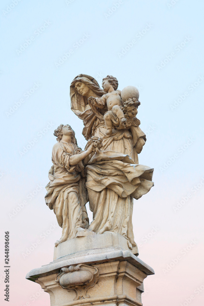 Prague, Czech Republic, Charles bridge. Saint Anna, mother of the virgin Mary, patroness of marriage, babies, mothers and widows. In the hands of St. Anne sits baby Jesus, holding the globe. 