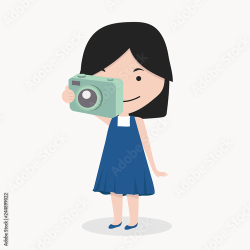 Smiling little girl take a photograph