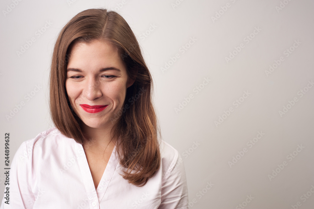 Portrait of charming woman standing on white