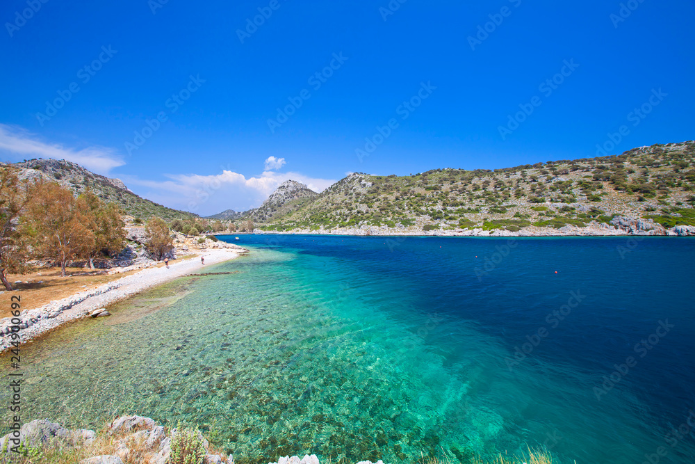 Turquoise waters of mediterranean and aegean sea with cliffs. Marmaris/Mugla. Greece and Turkish peninsula.