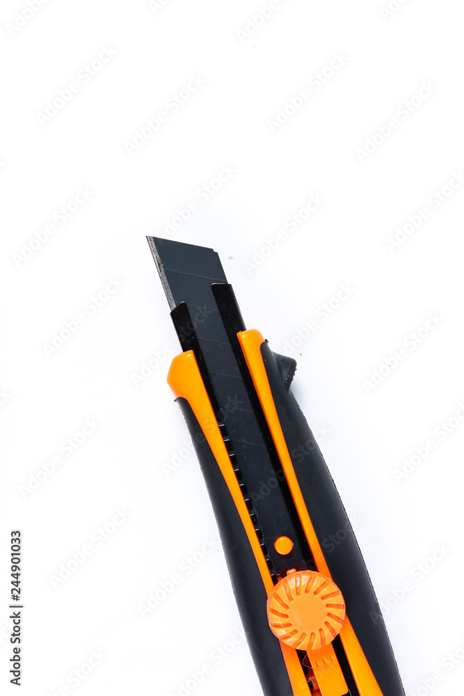 Orange and back paper knife or cutter on white background Orange and back paper knife or cutter on white background