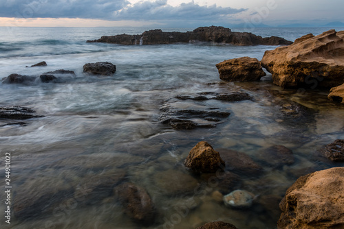 Long Exposure of the Mediterranean Sea along the Southern Italian Mediterranean Coast at Sunset © JonShore