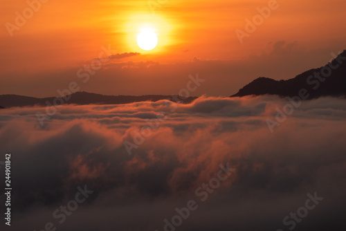 Beautiful dramatic sunset in the mountains. Landscape lot of fog Phu Thok Mountain at Chiang Khan ,Loei Province in Thailand. © fototrips