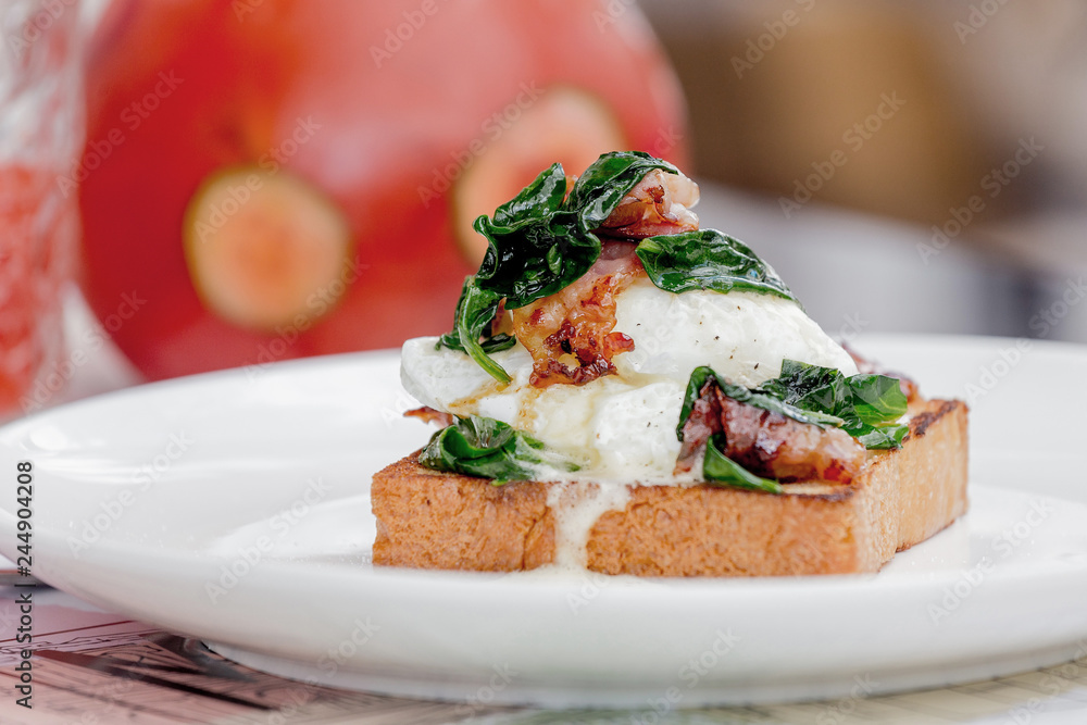Eggs benedict with brioche, bacon and spinach. Eggs benedict with brioche, bacon and spinach.