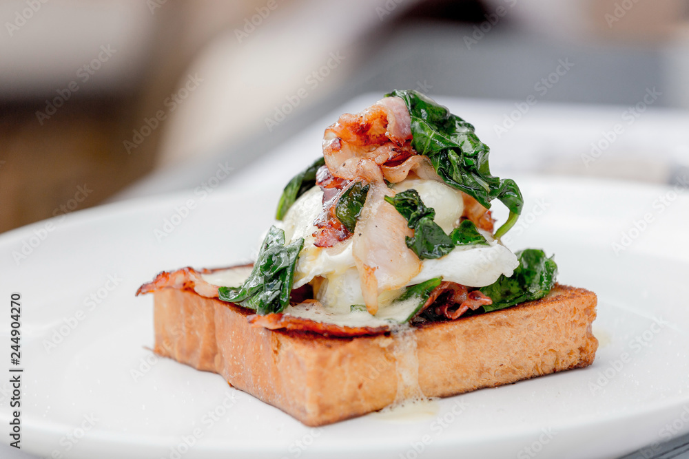 Eggs benedict with brioche, bacon and spinach. Eggs benedict with brioche, bacon and spinach.