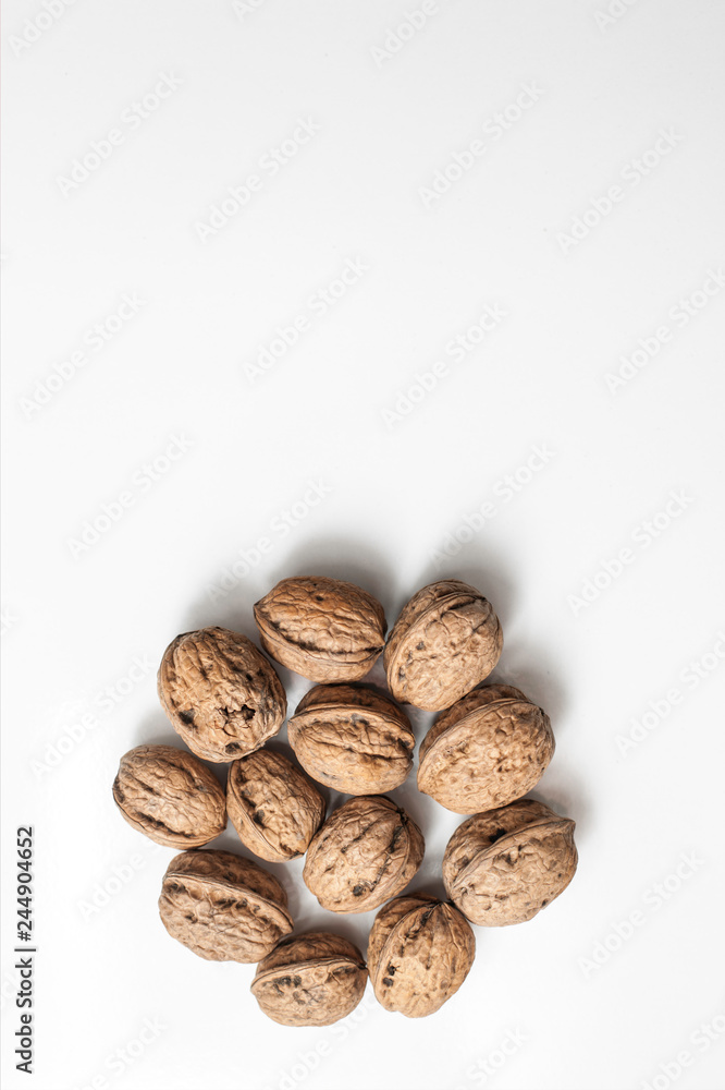 Useful walnuts, close-up, isolated on white background. Useful walnuts, close-up, isolated on white background.