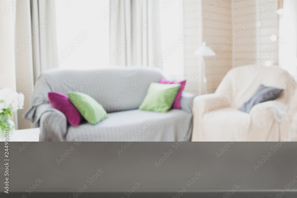 Fototapeta premium Blurred modern living room interior with chair, soft divan. Abstract background for design.