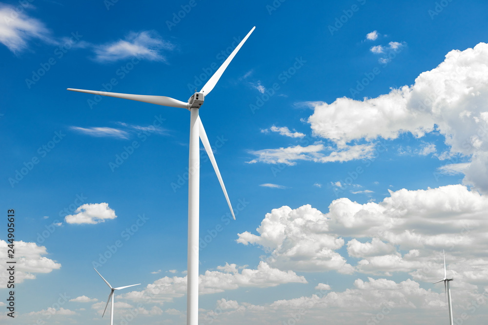 The wind generator is in bright cloudy sky. Eco energy concept. The wind generator is in bright cloudy sky. Eco energy concept.