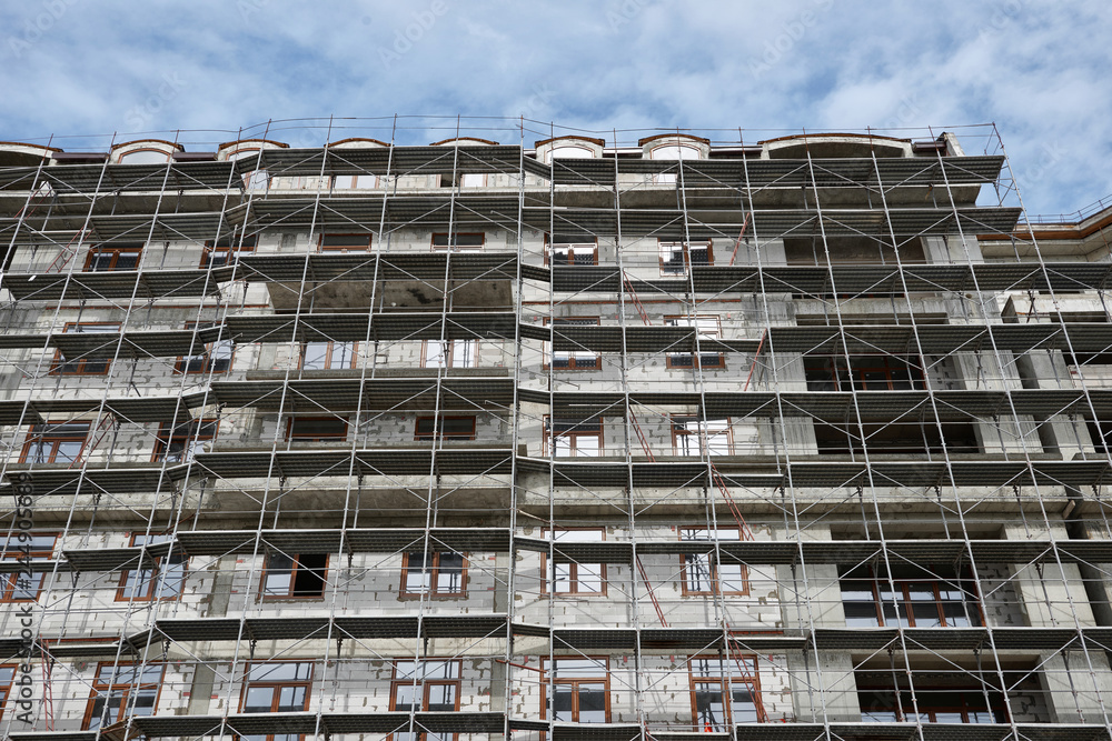 new building under construction, scaffolding and concrete