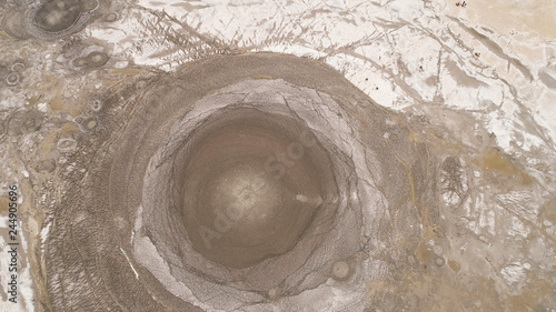 Mud volcano bledug kuwu. aerial view volcanic plateau with geothermal activity and geysers, Indonesia java. aerial view volcanic landscape photo