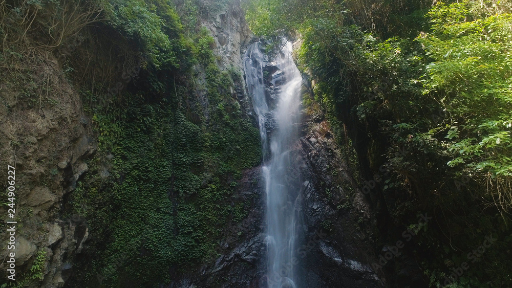aerial view waterfall in green rainforest. tropical waterfall in mountain jungle. Bali,Indonesia. Travel concept. aerial view waterfall in green rainforest. tropical waterfall in mountain jungle. Bali,Indonesia. Travel concept.