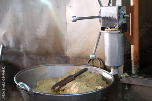 Wallpaper Mural cooking machine in the kitchen, making churros  Torontodigital.ca