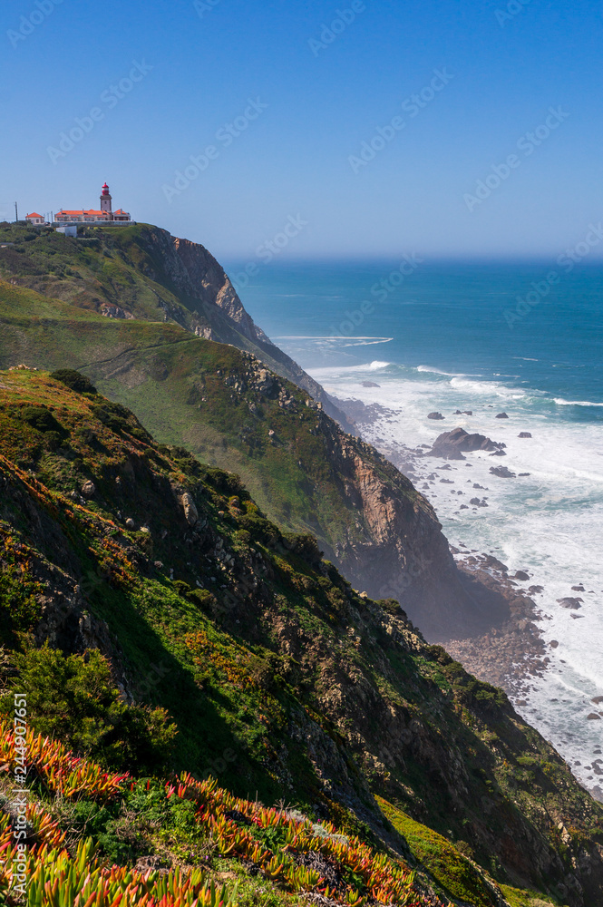 Fotografie Cabo da Roca, Sintra, Portugal, a famous tourist attraction with the lighthouse in the distance, standing above Atlantic Ocean