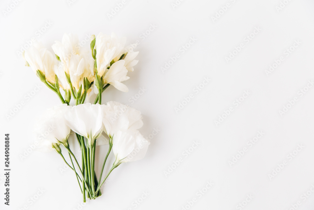 creative composition of white flowers.flat lay.flower background.minimalistic style
