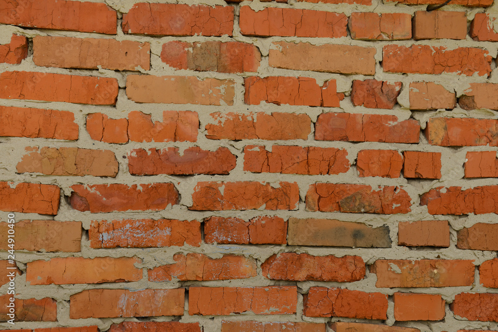 Obraz premium Brick wall with sloppy red brick masonry
