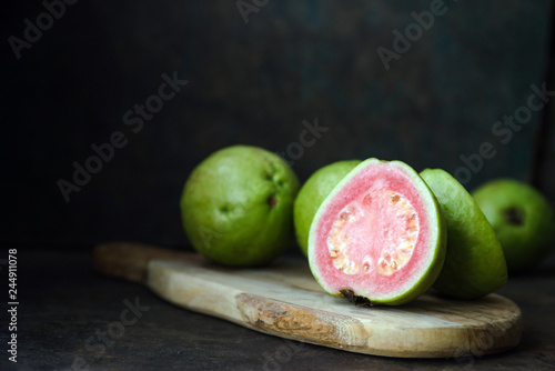 Fresh ripe guava on rustic background photo