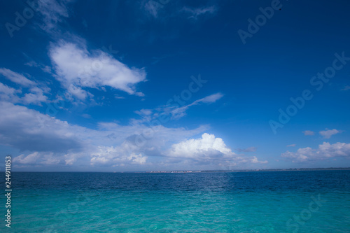 blue sky with clouds over ocean