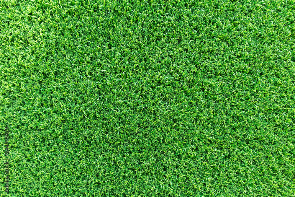 Obraz premium Grass texture background for golf course, soccer field or sports concept design. Artificial green grass.