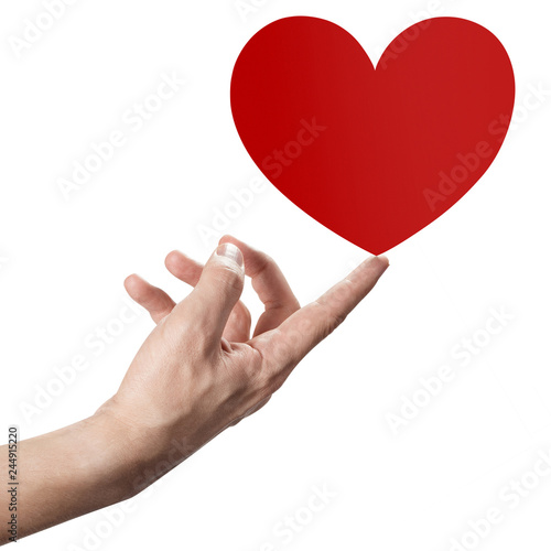 Hand holding a small red heart, isolated on white background