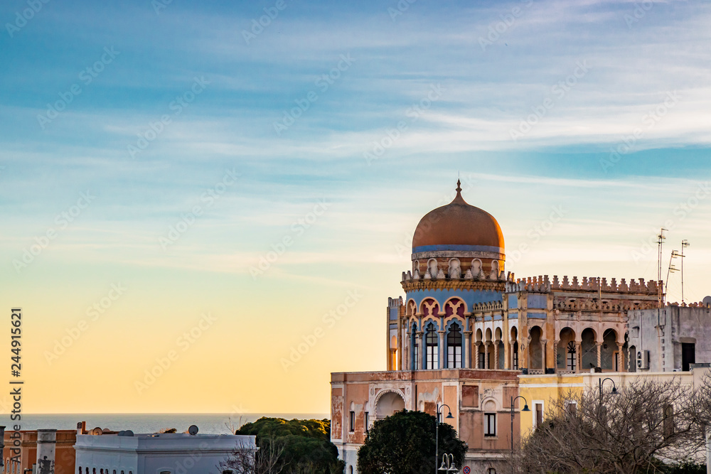 a view of Santa Cesarea Terme at sunset, with its splendid Arab and Moorish palaces, Puglia, Salento, Italy. Hydrothermal station in the province of Lecce, between Otranto and Santa Maria di Leuca.