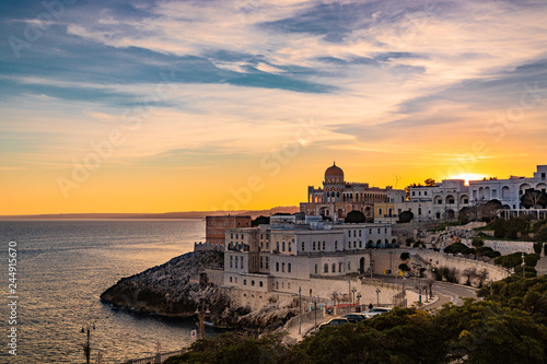 a view of Santa Cesarea Terme at sunset, with its splendid Arab and Moorish palaces, Puglia, Salento, Italy. Hydrothermal station in the province of Lecce, between Otranto and Santa Maria di Leuca. photo