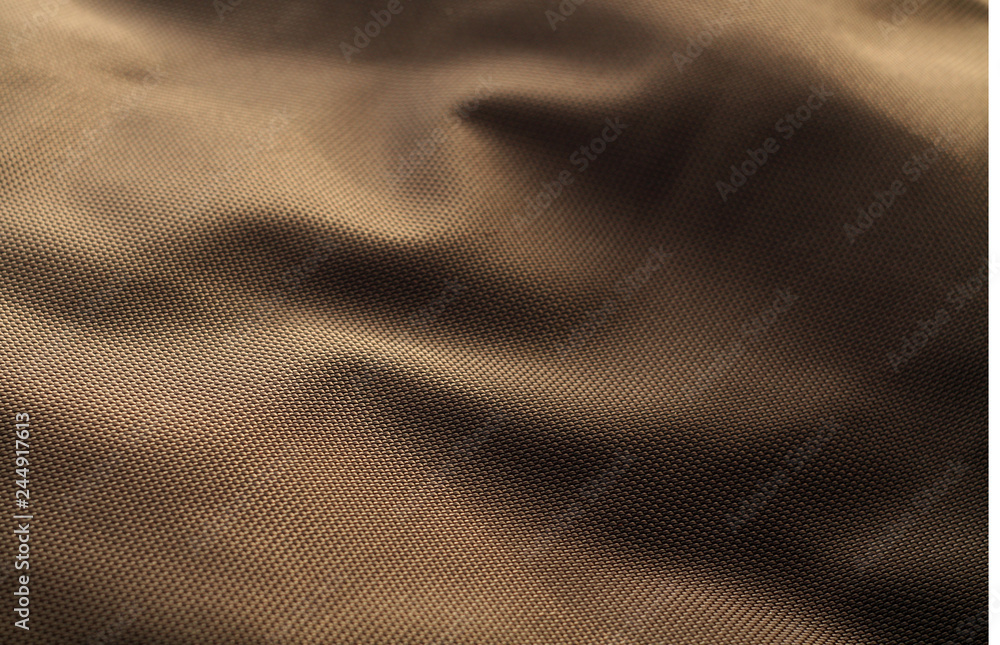 Brown color textile texture with blur effect. Brown color textile texture with blur effect.