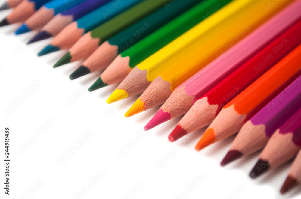 closeup of colouring pencils set on white background closeup of colouring pencils set on white background