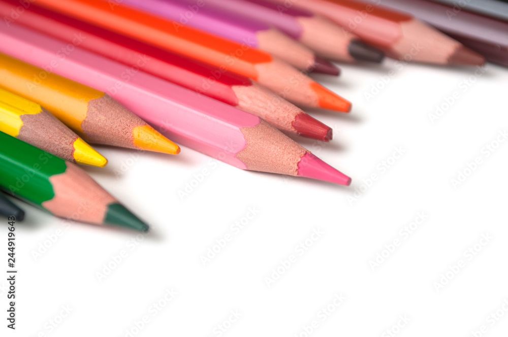 closeup of colouring pencils set on white background closeup of colouring pencils set on white background