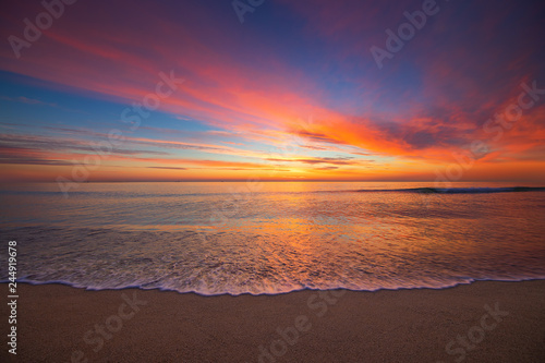 Beautiful cloudscape over the sea, sunrise shot. Tropical beach. © ValentinValkov