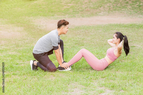 young couple exercising at the city park
