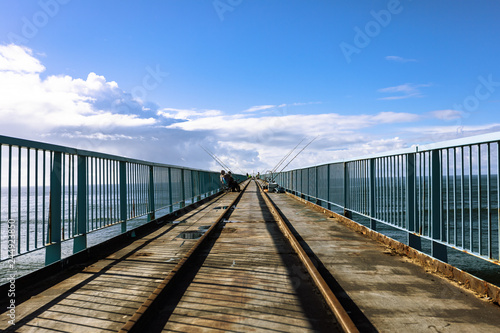 Angler on a bridge