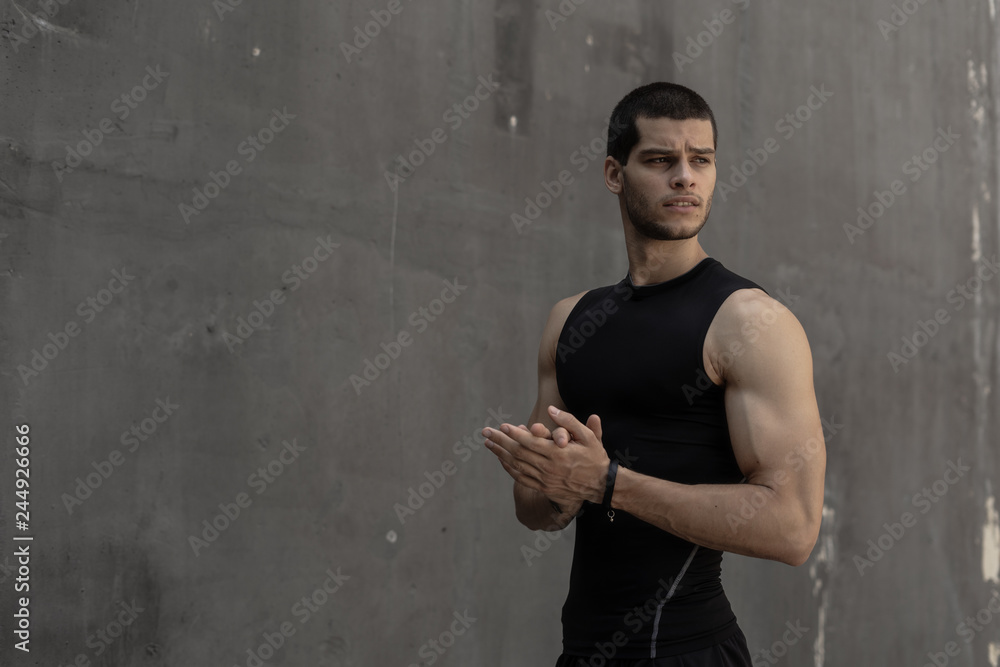 Attractive strong fashionable sporty sportive muscular man