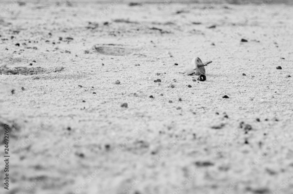 Electric plug lying on the sand. Sandy wasteland, in the distance you can see the forest. Electric plug lying on the sand. Sandy wasteland, in the distance you can see the forest.