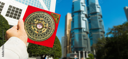 фотографія Feng Shui Master show FengShui Compass and turn direction to Force Energy, He we