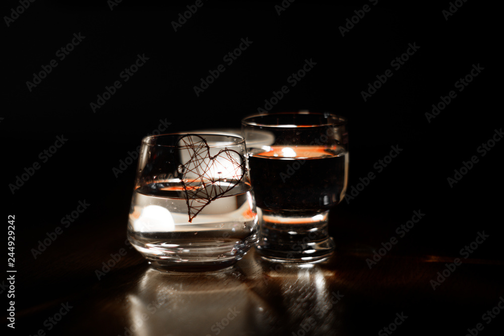 beautiful glasses in the flame of a candle