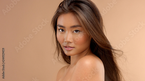 Wallpaper Mural profile portrait of asian japanese thai model watching to the camera. Natural asian makeup wet shiny skin Torontodigital.ca