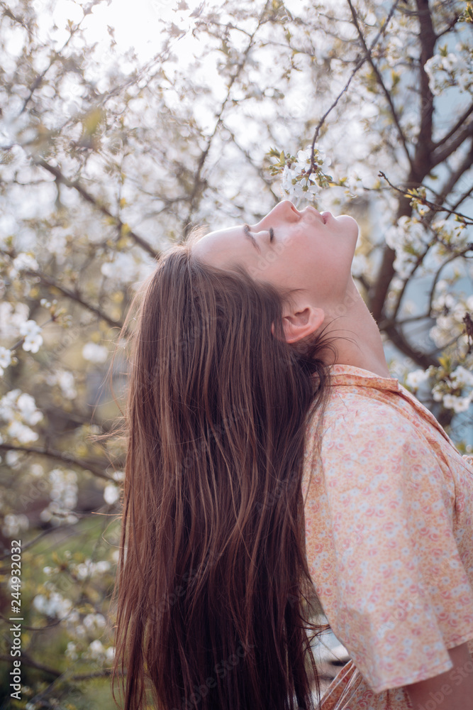 Blossoming of the apricot tree. Natural beauty and spa therapy. Summer girl with long hair. Spring woman. Springtime and vacation. face and skincare. Travel in summer. Woman with fashion makeup Blossoming of the apricot tree. Natural beauty and spa therapy. Summer girl with long hair. Spring woman. Springtime and vacation. face and skincare. Travel in summer. Woman with fashion makeup